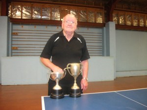 Hugh McIlwrath with the Over 80 Singles Cup and the Presidents Cup.