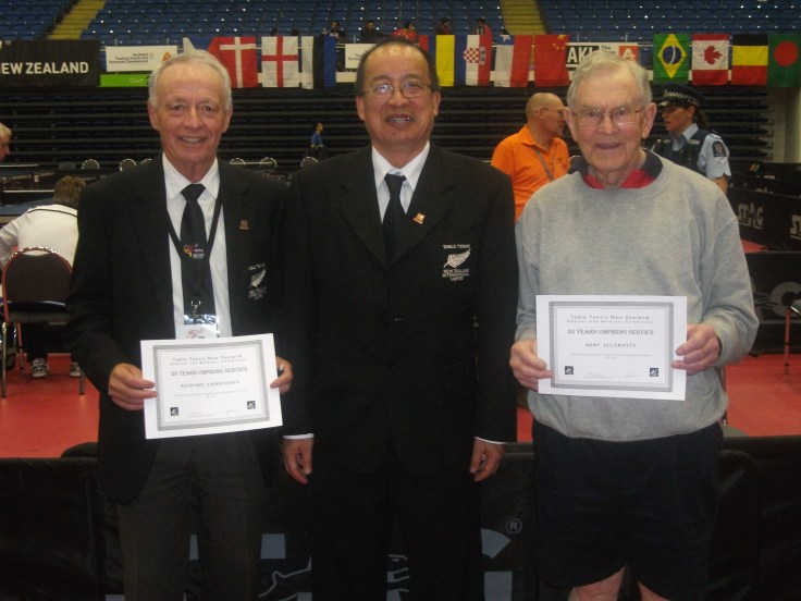 Richard Ammunden (Left) and Merv Allardyce (Right) receiving their 50 years umpiring service certificates from Malcolm Wong (URC).