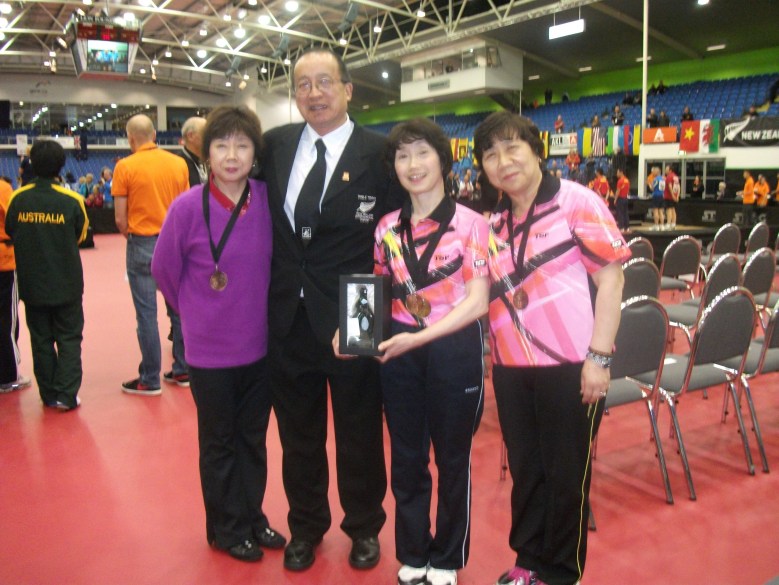 Malcolm Wong with the 2014 World Veteran Women’s  Over 50 Singles Champion Toshiko Kataoka (Japan) to right of him.