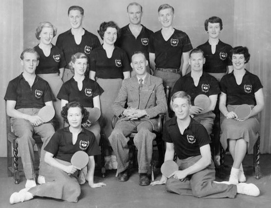 1953 Wellington Table Tennis Men’s and Women’s Teams. L/R back standing: Thyra McGregor, John Sigley, Eileen Brown, John Crossley, Murray Dunn, Pat Quinn  Center seated: Colin Shewan, Audrey Hughes, Keith Pratt (manager), Laurie Wilson, Charlotte Savage Front On floor: Ann Wah, Tony Darroch